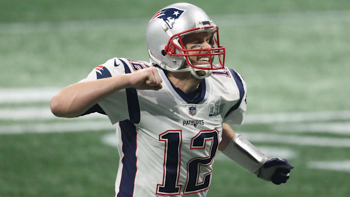 Feb 3, 2019; Atlanta, GA, USA; New England Patriots quarterback Tom Brady (12) celebrates after a Patriots touchdown  against the Los Angeles Rams during the fourth quarter of Super Bowl LIII at Mercedes-Benz Stadium.