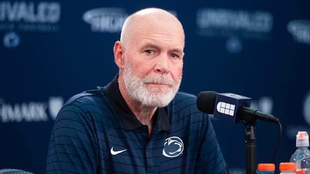 Penn State first-year defensive coordinator Jim Knowles talks with reporters during football media day