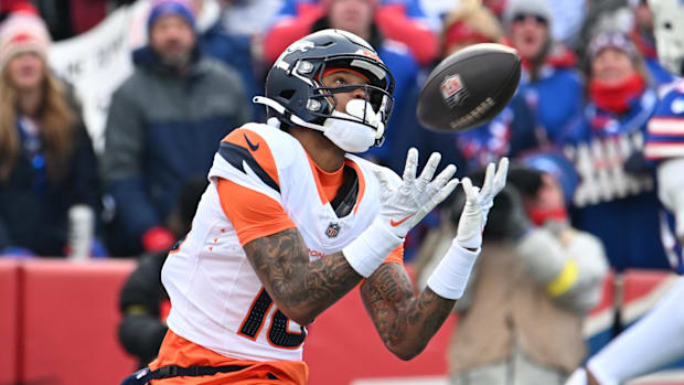 Jan 12, 2025; Orchard Park, New York, USA; Denver Broncos wide receiver Troy Franklin (16) catches a touchdown pass against t