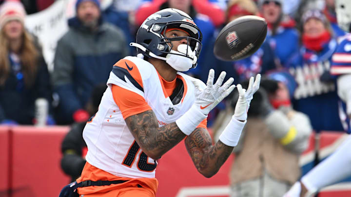 Jan 12, 2025; Orchard Park, New York, USA; Denver Broncos wide receiver Troy Franklin (16) catches a touchdown pass against the Buffalo Bills during the first quarter in an AFC wild card game at Highmark Stadium. Mandatory Credit: Mark Konezny-Imagn Images