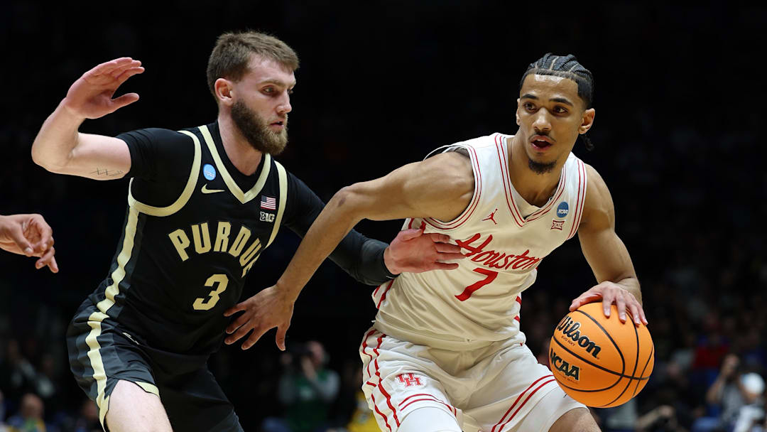 Mar 28, 2025; Indianapolis, IN, USA; Houston Cougars guard Milos Uzan (7) dribbles the ball against Purdue Boilermakers guard Braden Smith (3) in the first half during a Midwest Regional semifinal of the 2025 NCAA tournament at Lucas Oil Stadium. Mandatory Credit: Trevor Ruszkowski-Imagn Images