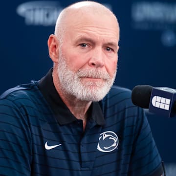 Penn State first-year defensive coordinator Jim Knowles talks with reporters during football media day in Beaver Stadium.