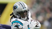 Green Bay Packers' Edgerrin Cooper pursues Carolina Panthers running back Rico Dowdle.