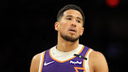 Apr 8, 2025; Phoenix, Arizona, USA; Phoenix Suns guard Devin Booker (1) reacts against the Golden State Warriors during the second half at Footprint Center. Mandatory Credit: Mark J. Rebilas-Imagn Images