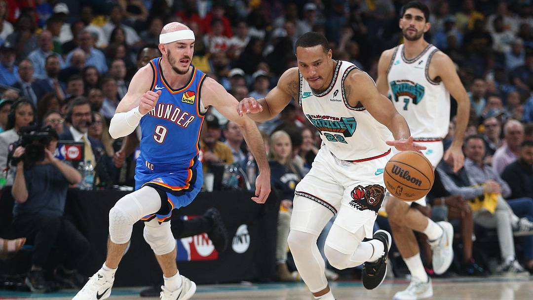 Apr 24, 2025; Memphis, Tennessee, USA; Memphis Grizzlies guard Desmond Bane (22) dribbles as Oklahoma City Thunder guard Alex Caruso (9) defends during the second quarter during game three for the first round of the 2025 NBA Playoffs at FedExForum. Mandatory Credit: Petre Thomas-Imagn Images Apr 24, 2025; Memphis, Tennessee, USA; Memphis Grizzlies guard Desmond Bane (22) dribbles as Oklahoma City Thunder guard Alex Caruso (9) defends during the second quarter during game three for the first round of the 2025 NBA Playoffs at FedExForum. Mandatory Credit: Petre Thomas-Imagn Images
