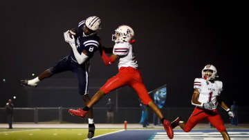 Siegel's Tarrion Grant (8) brings in a touchdown over Oakland's Gus Ramsey (3) during the second