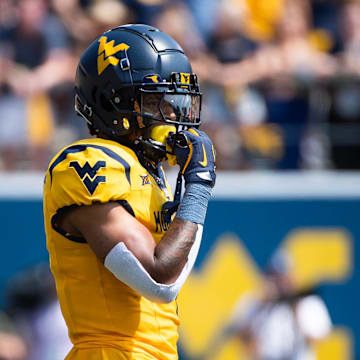 West Virginia running back Jahiem White prepares for a play in the first half of an NCAA football game against Penn State, Saturday, August 31, 2024, in Morgantown, W. Va.