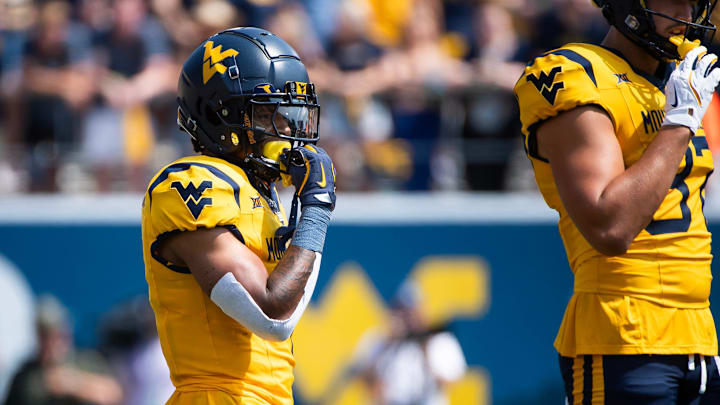 West Virginia running back Jahiem White prepares for a play in the first half of an NCAA football game against Penn State, Saturday, August 31, 2024, in Morgantown, W. Va.