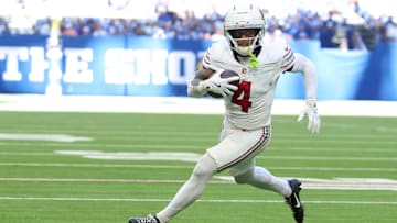 Oct 12, 2025; Indianapolis, Indiana, USA; Arizona Cardinals wide receiver Greg Dortch (4) carries the ball for a touchdown against the Arizona Cardinals during the third quarter of the game at Lucas Oil Stadium. Mandatory Credit: Trevor Ruszkowski-Imagn Images