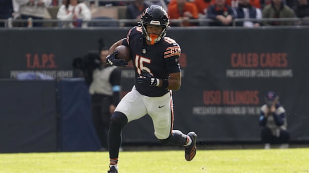 Chicago Bears wide receiver Rome Odunze (15) catches a pass and runs