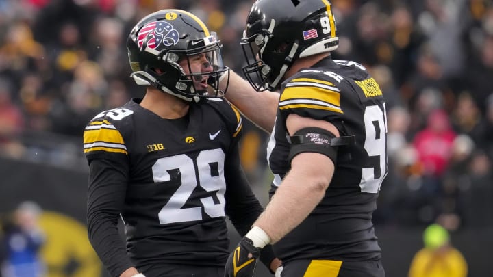 Iowa defensive lineman John Waggoner (92) celebrates with defensive back Sebastian Castro after Castro made a tackle in the second quarter against Wisconsin during a NCAA college football game in Iowa City on Saturday, Nov. 12, 2022.

Iowavswisconsin 20221112 Bh