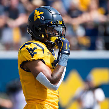 West Virginia running back Jahiem White prepares for a play in the first half of an NCAA football game against Penn State, Saturday, August 31, 2024, in Morgantown, W. Va.