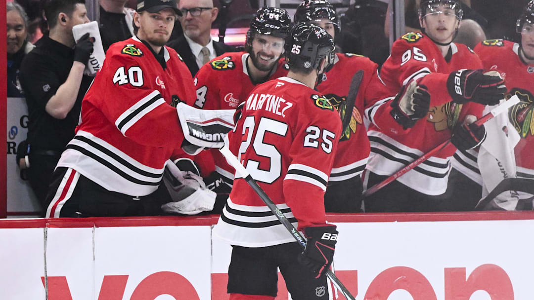 Mar 3, 2025; Chicago, Illinois, USA;  Chicago Blackhawks defenseman Alec Martinez (25), center, celebrates his goal against the Los Angeles Kings with  teammates during the first period at the United Center. Mandatory Credit: Matt Marton-Imagn Images