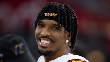 Sep 29, 2024; Glendale, Arizona, USA; Washington Commanders quarterback Jayden Daniels (5) against the Arizona Cardinals at State Farm Stadium. Mandatory Credit: Mark J. Rebilas-Imagn Images