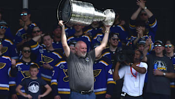 Jun 15, 2019; St. Louis, MO, USA; St. Louis Blues general manager Doug Armstrong hoists the Stanley Cup during the Stanley Cup championship parade and rally at the Gateway Arch. Mandatory Credit: Jeff Curry-Imagn Images