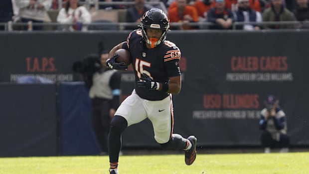 Chicago Bears wide receiver Rome Odunze (15) catches a pass and runs against the New England Patriots