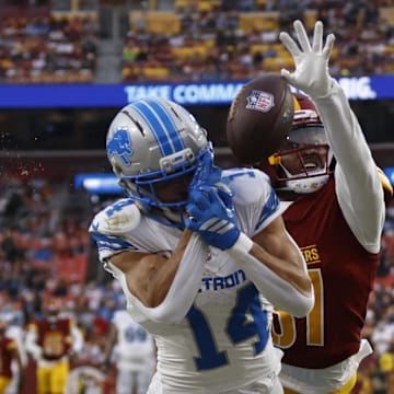Washington Commanders cornerback Jonathan Jones (31) breaks up a pass intended for Lions WR Amon-Ra St. Brown