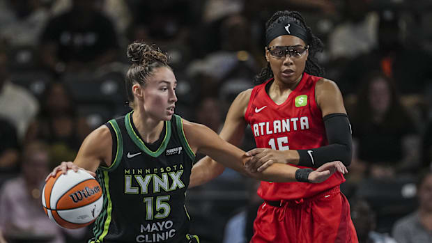 Minnesota Lynx forward Jessica Shepard (15) dribbles defended by Atlanta Dream guard Allisha Gray (15)