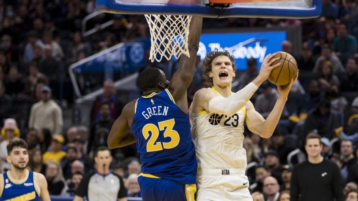 Dec 28, 2022; San Francisco, California, USA;  Golden State Warriors forward Draymond Green (23) blocks a shot by Utah Jazz forward Lauri Markkanen (23) during the second half at Chase Center. Mandatory Credit: John Hefti-USA TODAY Sports