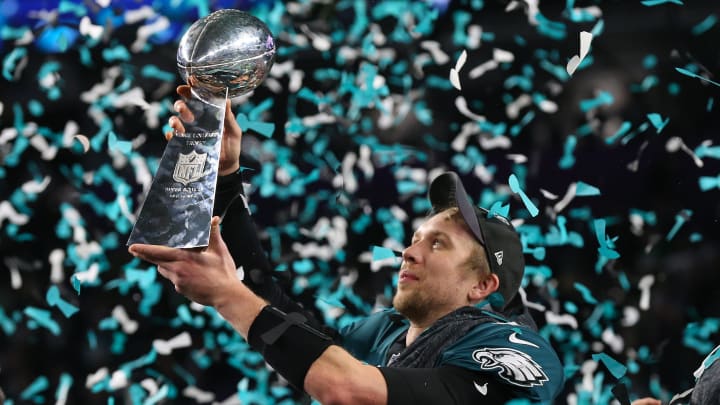 Feb 4, 2018; Minneapolis, MN, USA; Philadelphia Eagles quarterback Nick Foles (9) hoist the Vince Lombardi Trophy after a victory against the New England Patriots in Super Bowl LII at U.S. Bank Stadium. 