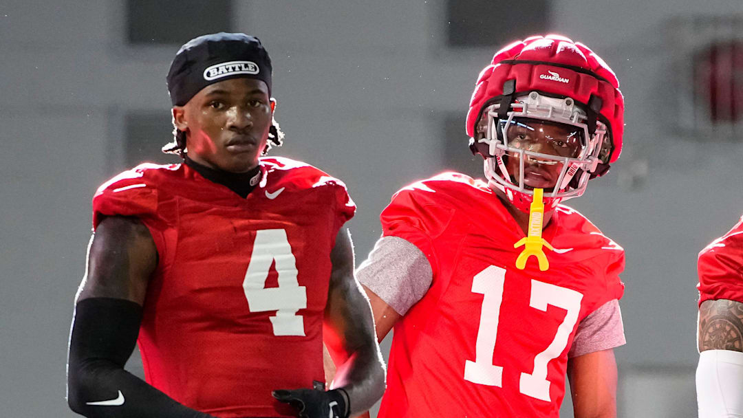 Ohio State Buckeyes wide receivers Jeremiah Smith (4), Carnell Tate (17) and Brandon Inniss (1) watch during spring football practice at the Woody Hayes Athletic Center on March 17, 2025.