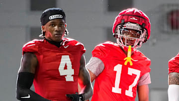 Ohio State Buckeyes wide receivers Jeremiah Smith (4), Carnell Tate (17) and Brandon Inniss (1) watch during spring football practice at the Woody Hayes Athletic Center on March 17, 2025.