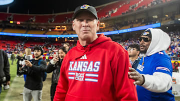 Nov 23, 2024; Kansas City, Missouri, USA;  Kansas head coach Lance Leipold interacts with with individuals after his teams victory over the Colorado Buffaloes at GEHA Field at Arrowhead Stadium. Mandatory Credit: Nick Tre. Smith-Imagn Images