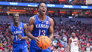 Kansas Jayhawks guard Elmarko Jackson (13) and Kansas Jayhawks guard Melvin Council Jr. (14) react in the second half during the Jayhawks' 90-82 win over the Louisville Cardinals in an exhibition basketball game at the KFC Yum! Center in Louisville, Kentucky Friday, October 24, 2025.