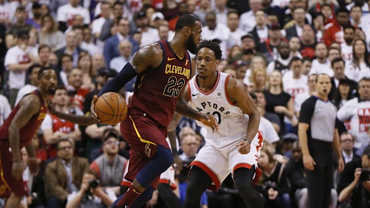 May 1, 2018; Toronto, Ontario, CAN; Cleveland Cavaliers forward LeBron James (23) tries to dribble arund Toronto Raptors guard DeMar DeRozan (10) during game one of the second round of the 2018 NBA Playoffs at Air Canada Centre. Cleveland defeated Toronto in overtime. Mandatory Credit: John E. Sokolowski-Imagn Images