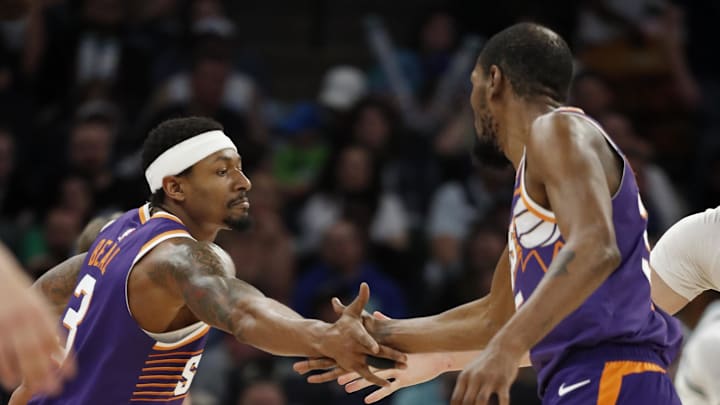 Apr 14, 2024; Minneapolis, Minnesota, USA; Phoenix Suns guard Bradley Beal (3) celebrates his basket against the Minnesota Timberwolves with forward Kevin Durant (35) in the fourth quarter at Target Center. Mandatory Credit: Bruce Kluckhohn-Imagn Images