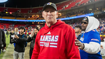 Nov 23, 2024; Kansas City, Missouri, USA;  Kansas head coach Lance Leipold interacts with with individuals after his teams victory over the Colorado Buffaloes at GEHA Field at Arrowhead Stadium. Mandatory Credit: Nick Tre. Smith-Imagn Images