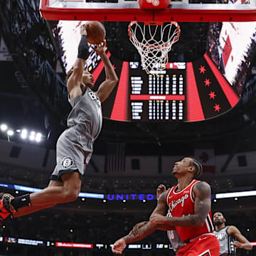 Jan 12, 2022; Chicago, Illinois, USA; Brooklyn Nets forward Kessler Edwards (14) goes up for a dunk against the Chicago Bulls during the first half at United Center. Mandatory Credit: Kamil Krzaczynski-Imagn Images