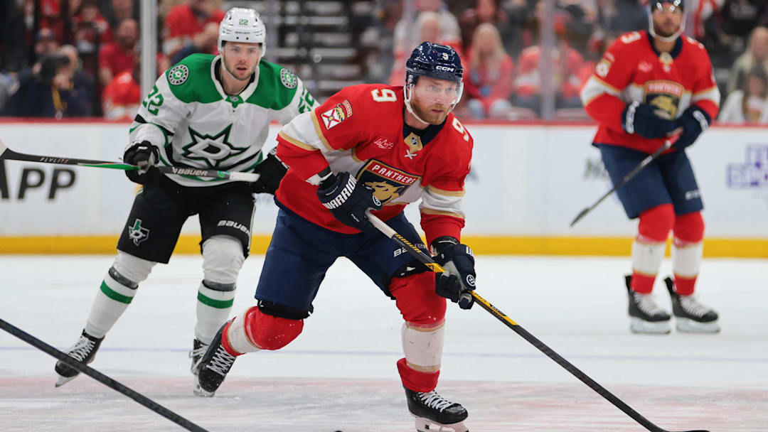 Nov 1, 2025; Sunrise, Florida, USA; Florida Panthers center Sam Bennett (9) moves the puck against the Dallas Stars during the third period at Amerant Bank Arena. Mandatory Credit: Sam Navarro-Imagn Images