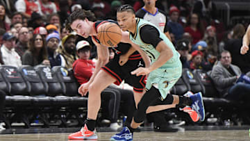 Dec 13, 2024; Chicago, Illinois, USA; Chicago Bulls guard Josh Giddey (3) chases the ball with Charlotte Hornets guard Isaiah Wong (21) during the second half at the United Center. Mandatory Credit: Matt Marton-Imagn Images