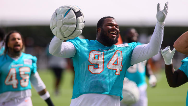 Jul 28, 2024; Miami Gardens, FL, USA; Miami Dolphins defensive tackle Teair Tart (94) reacts toward the fans during training camp at Baptist Health Training Complex. Mandatory Credit: Sam Navarro-USA TODAY Sports