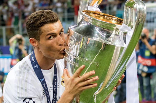 Cristiano Ronaldo kissing the Champions League trophy.