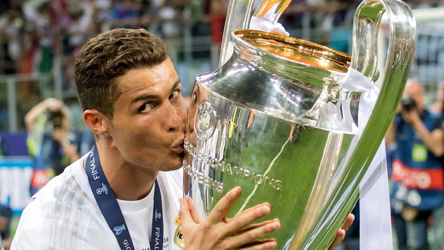 Cristiano Ronaldo kissing the Champions League trophy.
