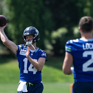 Jun 11, 2025; Renton, WA, USA; Seattle Seahawks quarterback Sam Darnold (14) passes the ball to quarterback Drew Lock (2) during mini-camp at Virginia Mason Athletic Center. 