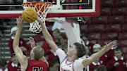 Oct 30, 2024; Madison, Wisconsin: Wisconsin forward Nolan Winter (31) blocks a shot by UW-River Falls forward Drew Adams (24) during the second half of their preseason game Wednesday, October 30, 2024 at the Kohl Center in Madison, Wisconsin. Mark Hoffman/Imagn Images