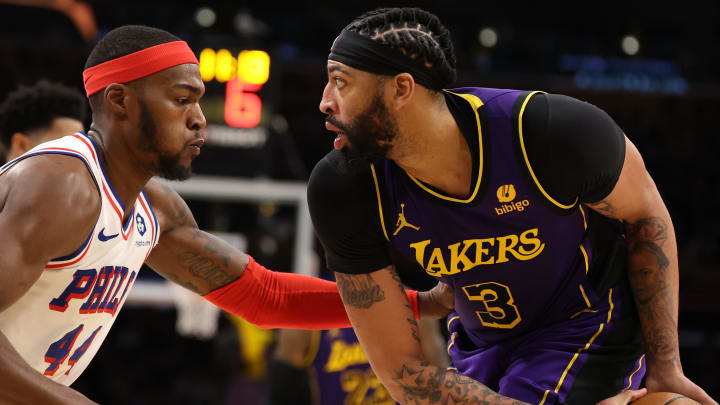 Mar 22, 2024; Los Angeles, California, USA;  Los Angeles Lakers forward Anthony Davis (3) posts up against Philadelphia 76ers forward Paul Reed (44) during the fourth quarter at Crypto.com Arena. Mandatory Credit: Kiyoshi Mio-USA TODAY Sports