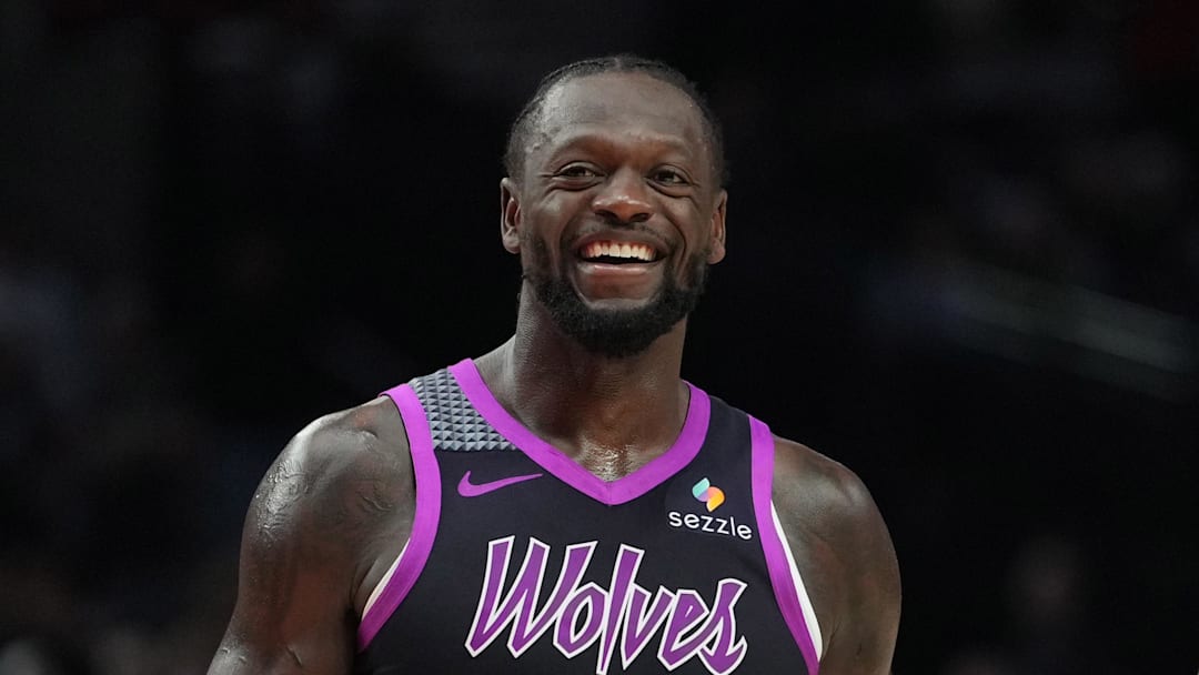Feb 24, 2026; Portland, Oregon, USA; Minnesota Timberwolves forward Julius Randle (30) and Portland Trail Blazers guard Jrue Holiday (5) share a laugh during the second half at Moda Center. Mandatory Credit: Soobum Im-Imagn Images