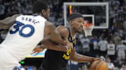 Minnesota Timberwolves forward Julius Randle fouls Golden State Warriors forward Jimmy Butler in the 2025 NBA Playoffs 