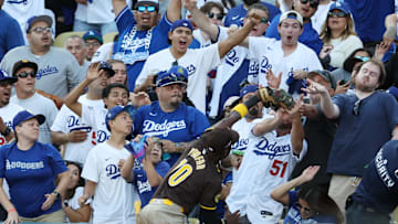  San Diego Padres outfielder Jurickson Profar (10) catches a ball hit by Los Angeles Dodgers shortstop Mookie Betts (50) in the first inning during game two of the NLDS for the 2024 MLB Playoffs at Dodger Stadium. Mandatory Credit: Kiyoshi Mio-Imagn Images
