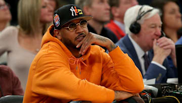Mar 8, 2023; New York, NY, USA; New York Knicks former player Carmelo Anthony sits courtside during the second half between the Villanova Wildcats and the Georgetown Hoyas at Madison Square Garden. Mandatory Credit: Brad Penner-Imagn Images