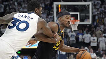 Minnesota Timberwolves forward Julius Randle fouls Golden State Warriors forward Jimmy Butler in the 2025 NBA Playoffs 