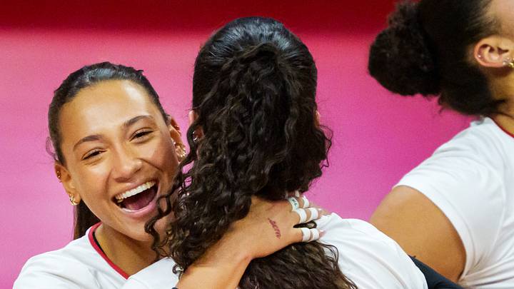 Dec 14, 2025; Lincoln, NE, USA; Nebraska Cornhuskers outside hitter Harper Murray (27) and opposite Virginia Adriano (9) embrace after a point against the Texas A&M Aggies during the third set at Bob Devaney Sports Center. Mandatory Credit: Dylan Widger-Imagn Images Dec 14, 2025; Lincoln, NE, USA; Nebraska Cornhuskers outside hitter Harper Murray (27) and opposite Virginia Adriano (9) embrace after a point against the Texas A&M Aggies during the third set at Bob Devaney Sports Center. Mandatory Credit: Dylan Widger-Imagn Images