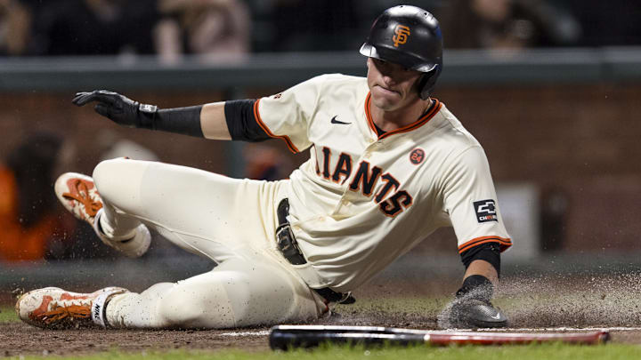 Sep 11, 2024; San Francisco, California, USA; San Francisco Giants shortstop Tyler Fitzgerald (49) slides home to score against the Milwaukee Brewers during the fourth inning at Oracle Park