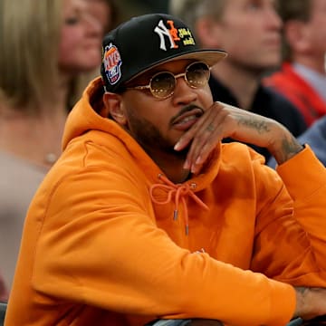 Mar 8, 2023; New York, NY, USA; New York Knicks former player Carmelo Anthony sits courtside during the second half between the Villanova Wildcats and the Georgetown Hoyas at Madison Square Garden. Mandatory Credit: Brad Penner-Imagn Images