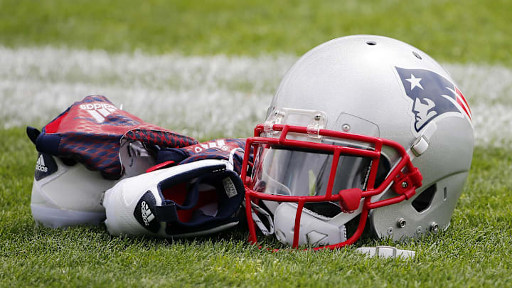 Jul 30, 2015; Foxborough, MA, USA; A New England Patriots helmet, shoes and gloves sit on the field during training camp at Gillette Stadium. Mandatory Credit: Winslow Townson-Imagn Images
