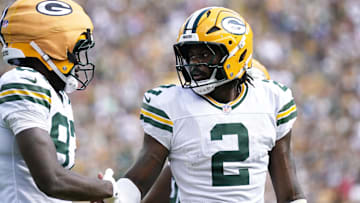 Aug 23, 2025; Green Bay, Wisconsin, USA; Green Bay Packers quarterback Malik Willis (2) celebrates a touchdown scored by Green Bay Packers wide receiver Romeo Doubs (87) during the first half at Lambeau Field. Mandatory Credit: Kayla Wolf-Imagn Images